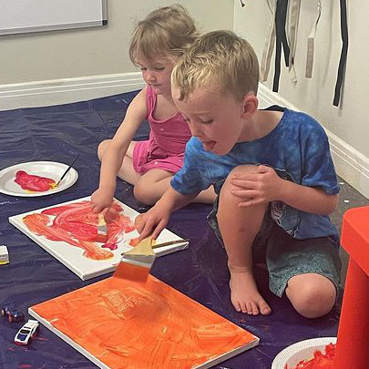 kids painting at branches and brushes